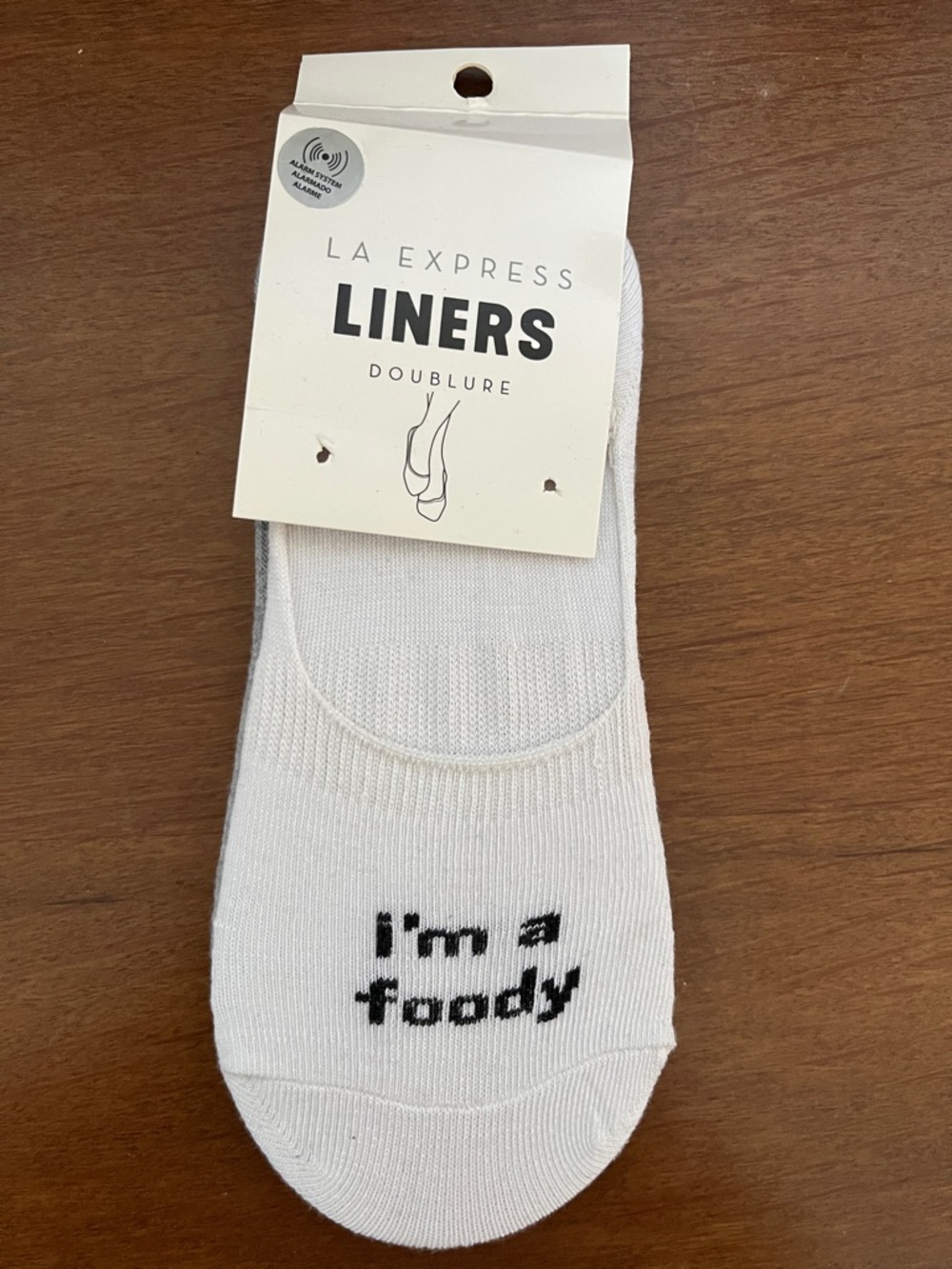 LA Express No-Show Liners with text (white) and food (grey)